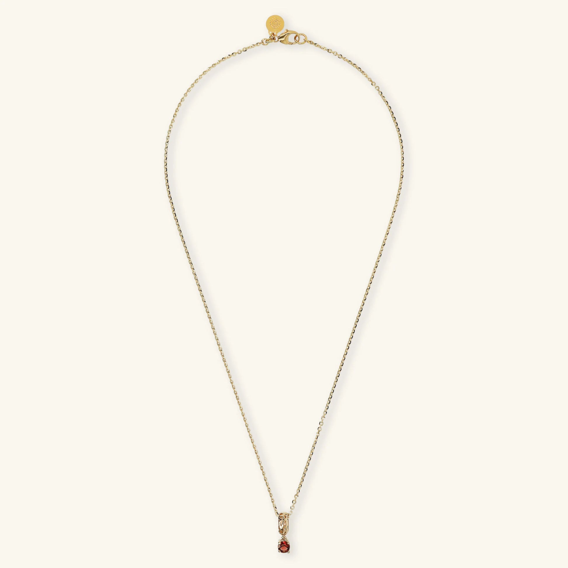 Necklace With Openwork Pendant and Red Garnet