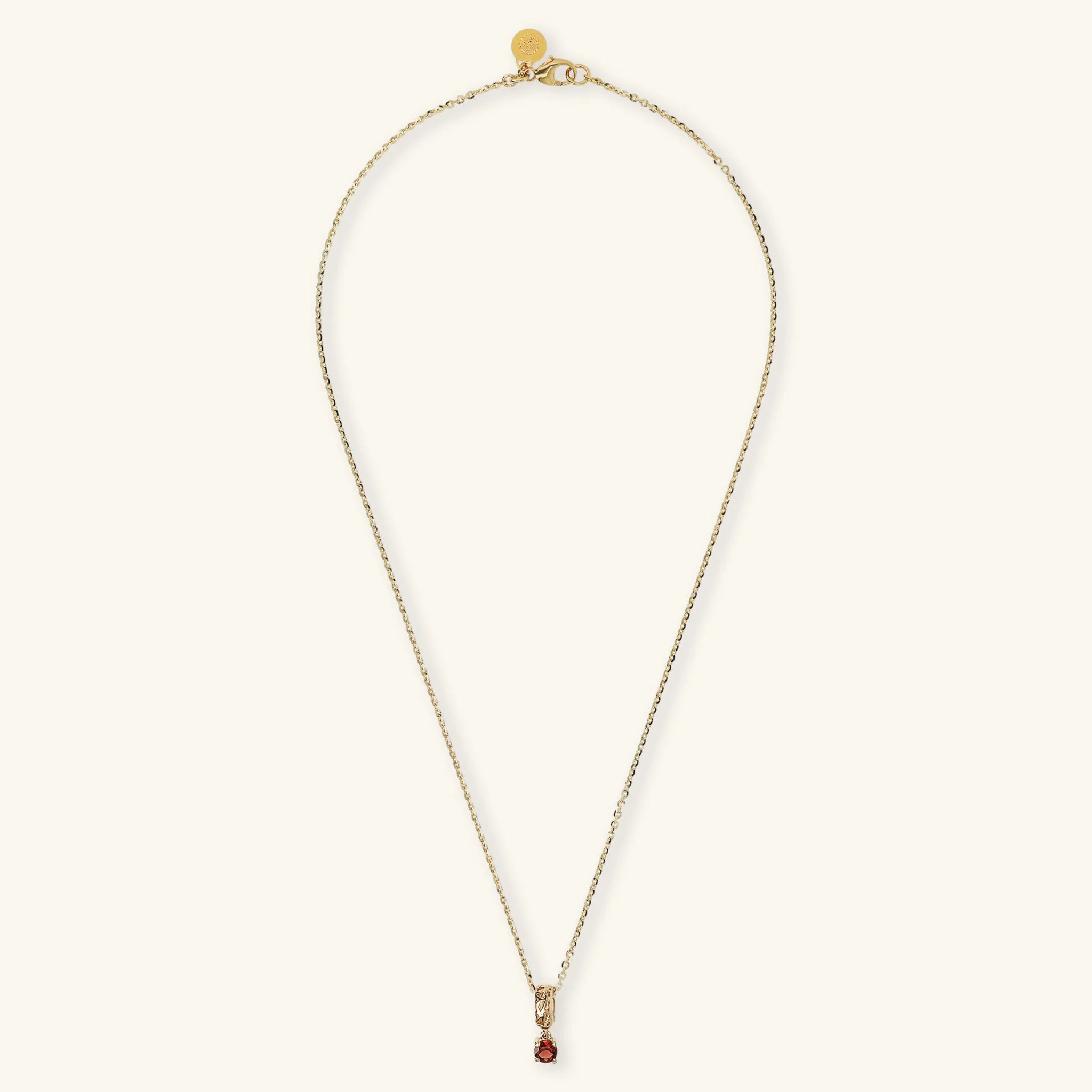 Necklace With Openwork Pendant and Red Garnet